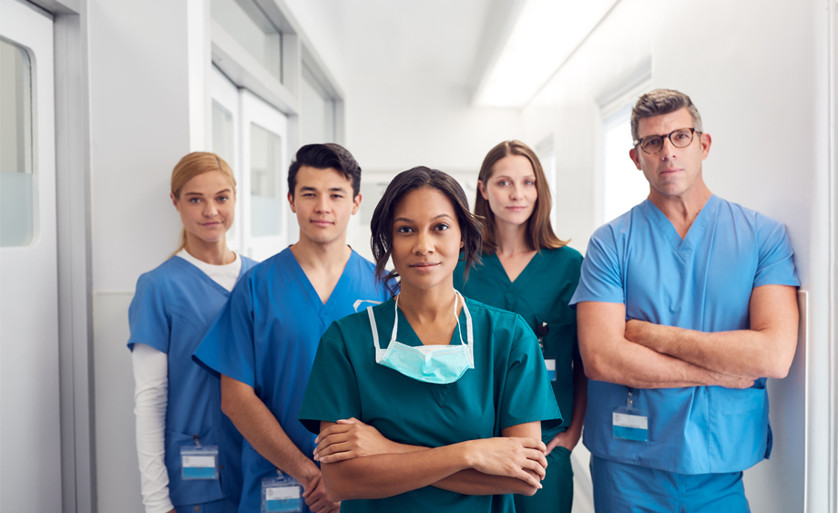 Healthcare Workers Standing Together With Arms Folded