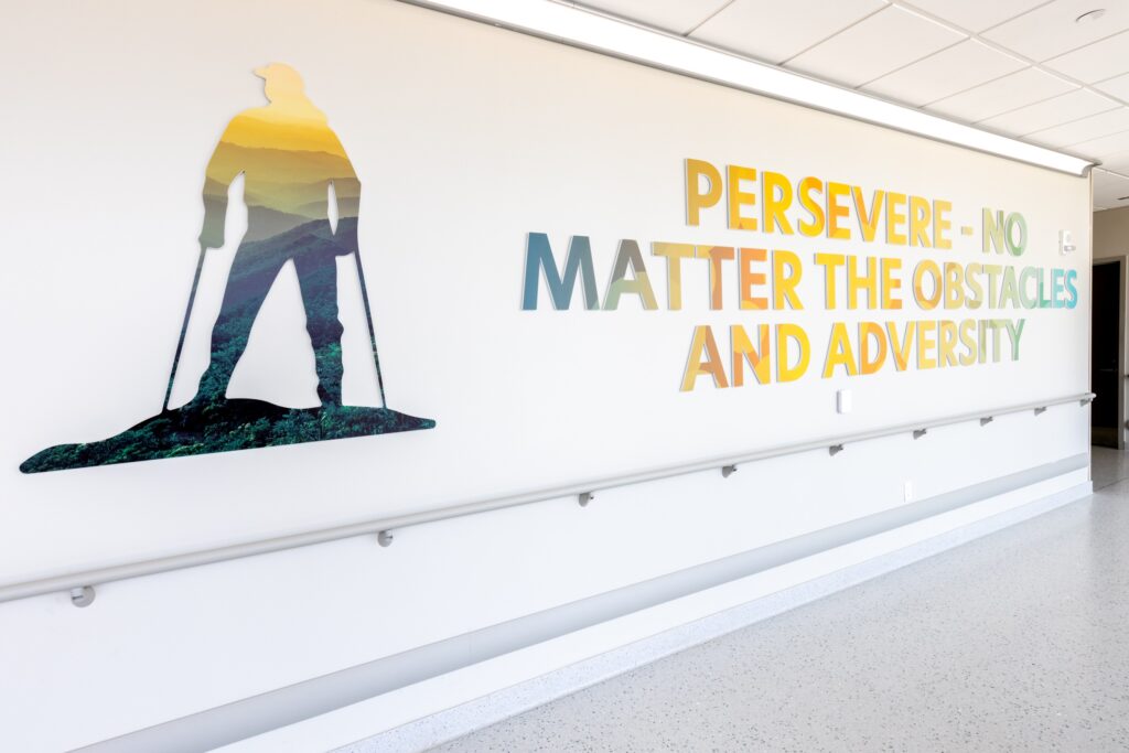 An inspirational message saying Persevere - No Matter The Obstacles And Adversity in the hallway of the private patient entrance at Good Shepherd Rehabilitation Hospital