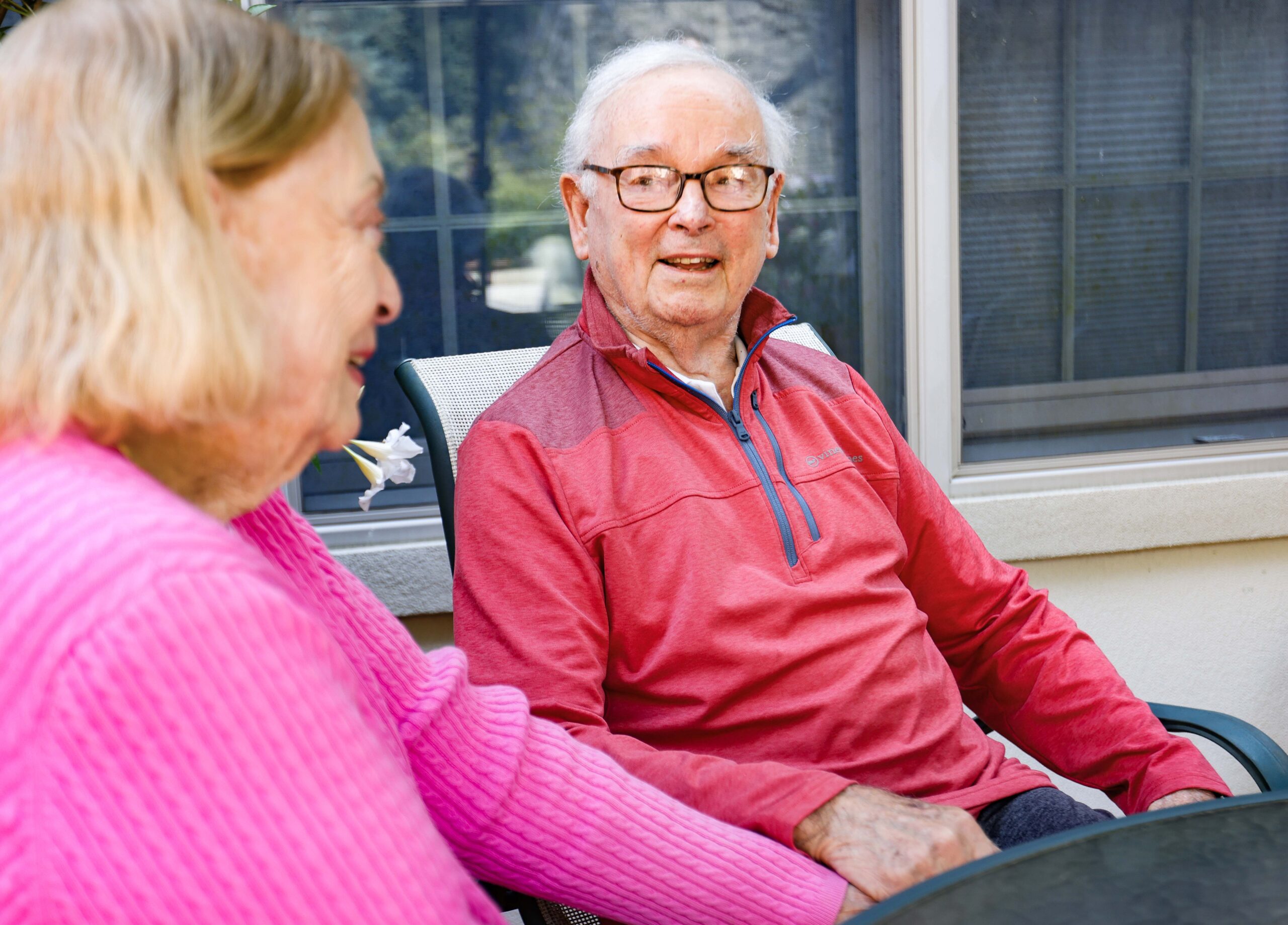 Ken Smith sits on his back patio with his wife, Barbara